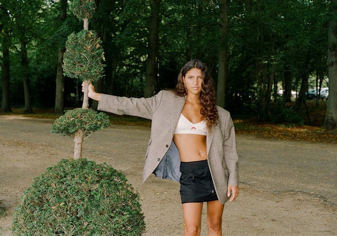 tree skirt coat jacket adult female person woman blazer vegetation