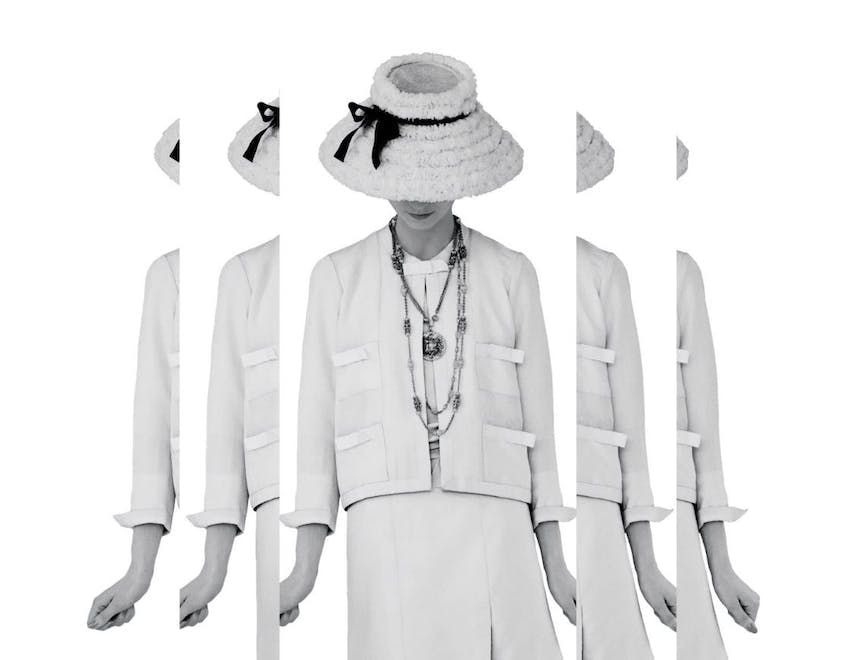 clothing hat person formal wear suit long sleeve sleeve coat jewelry necklace