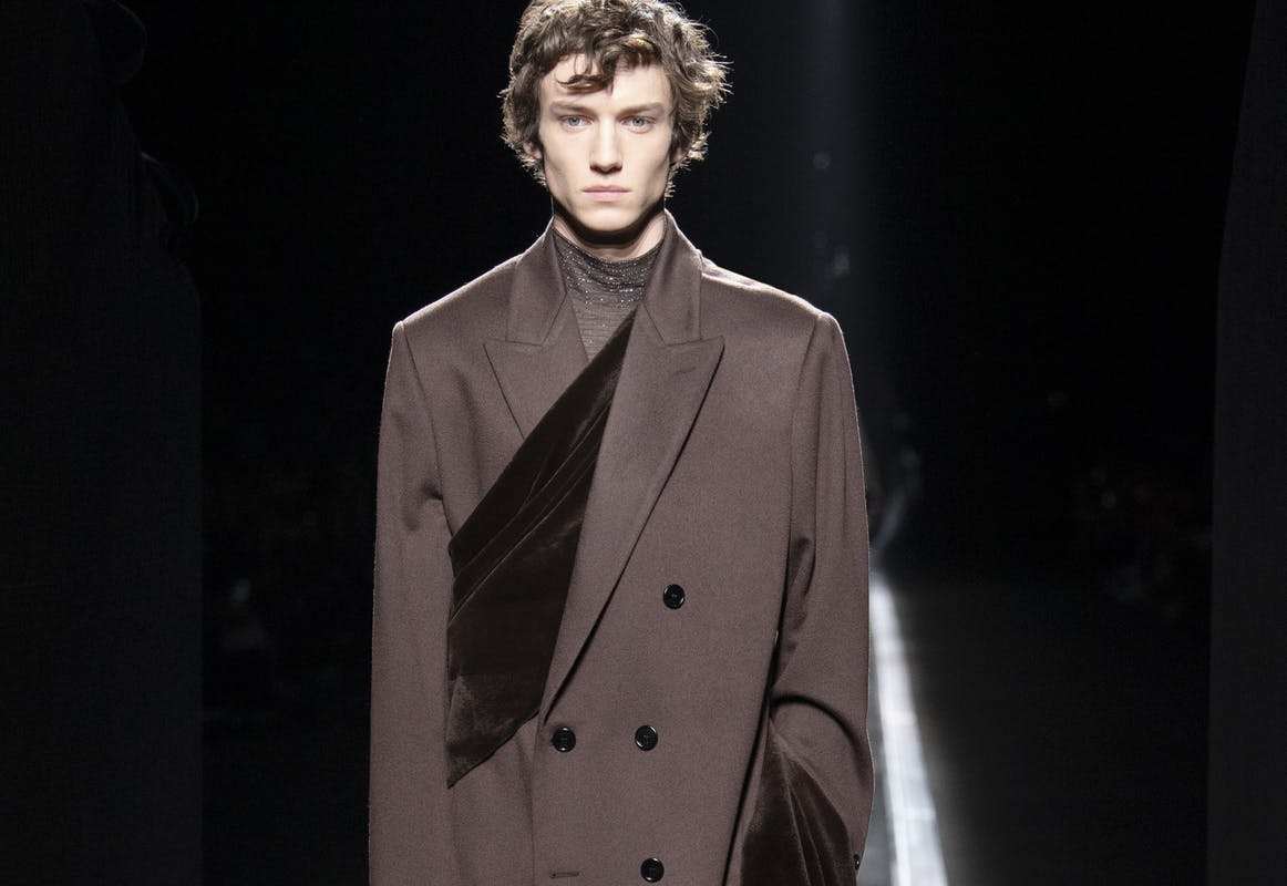 clothing apparel suit overcoat coat person human tuxedo
