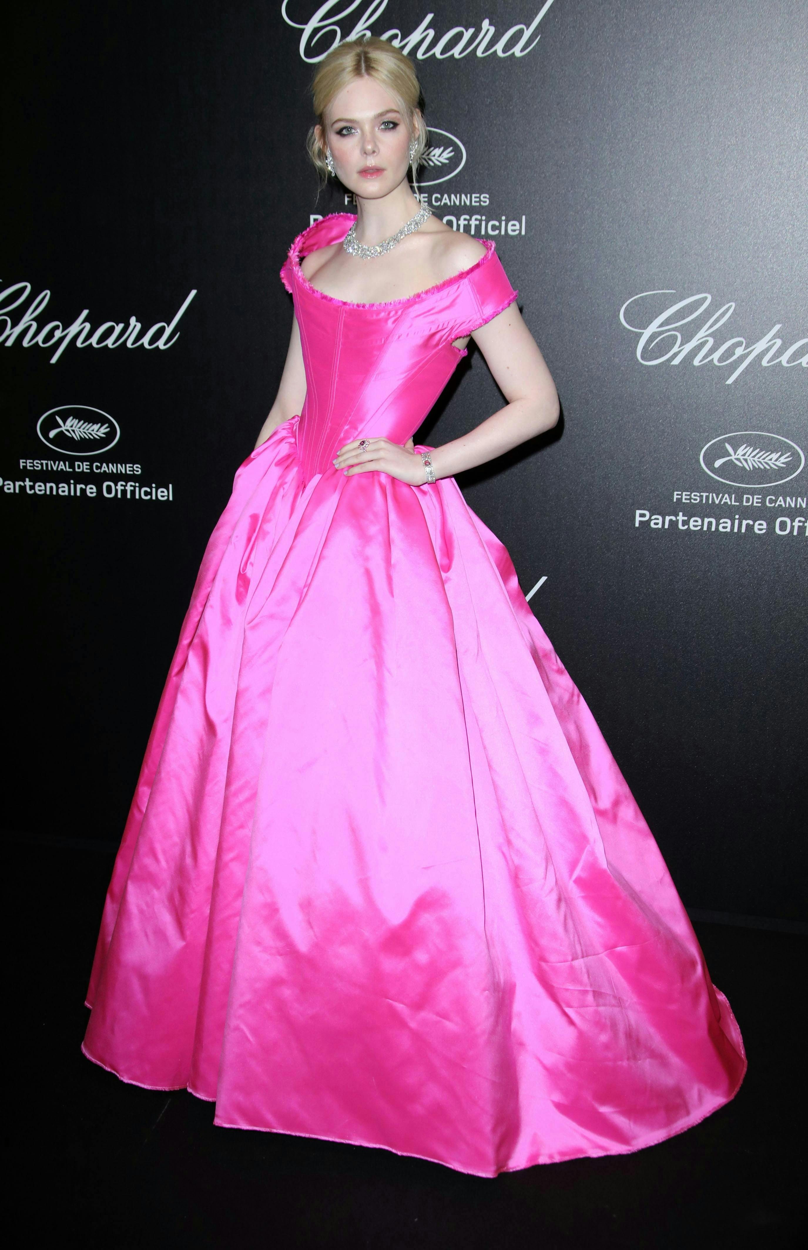 chopard party 72nd cannes film festival france 17 may 2019 elle fanning wearing vivienne westwood neon pink dress fluorescent off shoulder corset bodice full skirt floor long gown fashion actor alone female full length personality 80612015 clothing apparel person human woman