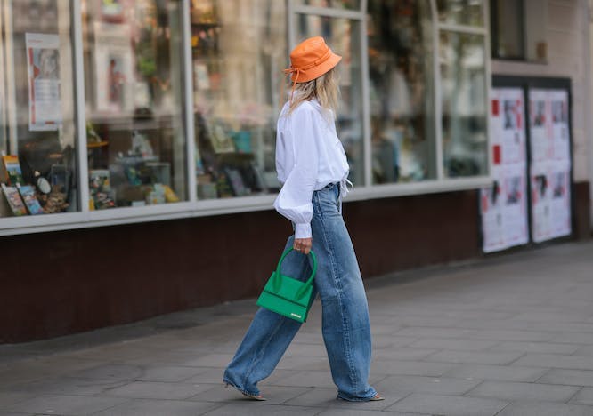 clothing apparel jeans denim pants person shoe footwear sun hat hat