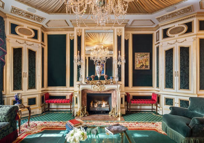 10 east 64th street family home ivana trump new york city ornate townhouse traditional upper east side home decor reception room waiting room indoors living room furniture interior design chandelier fireplace couch