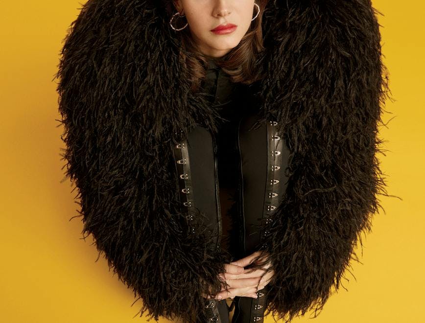 coat clothing person woman adult female glove fur
