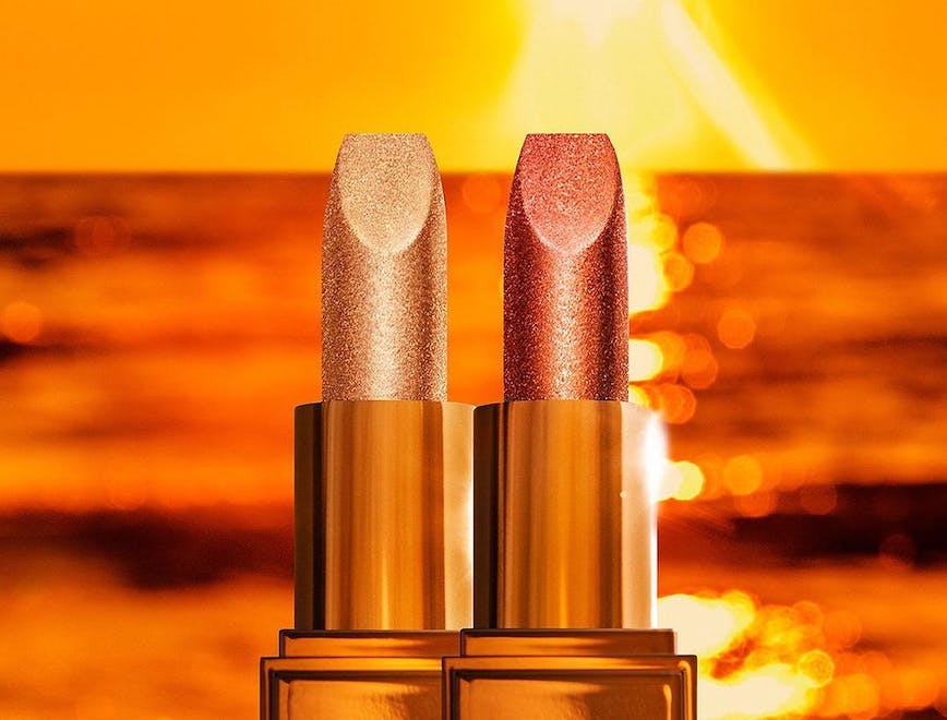 New Soleil de Feu Spark Lip Balm hydrates lips with a moisturizing tint for a plumped, sunlit sheen.