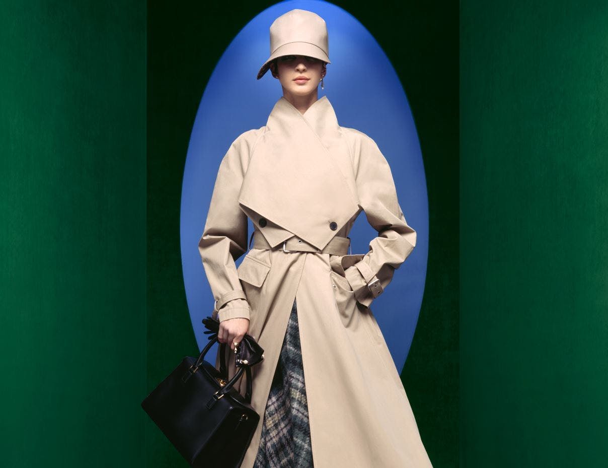 clothing coat overcoat fashion bag handbag long sleeve sleeve face person