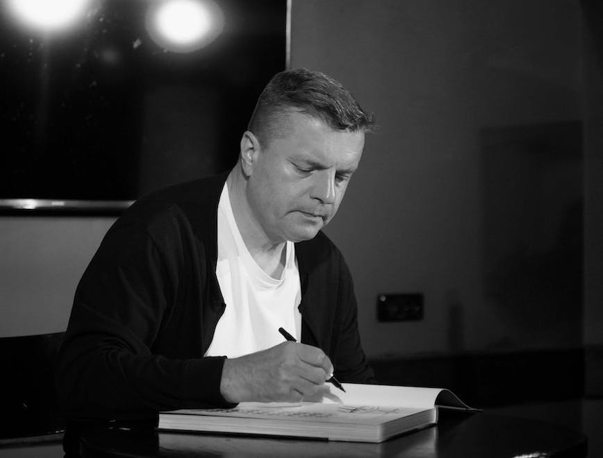 person photography portrait finger adult male man pen reading sitting