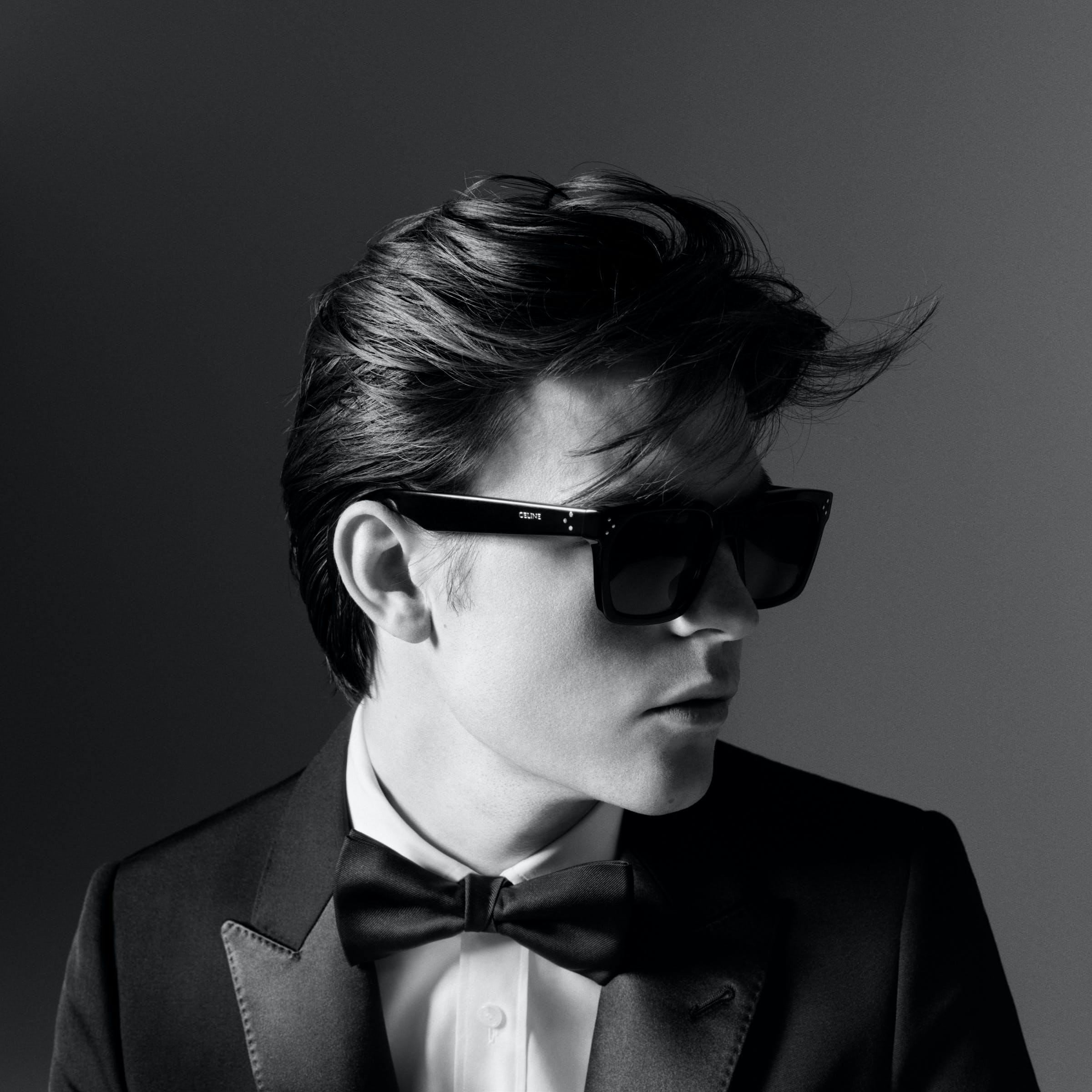 accessories sunglasses formal wear person photography portrait tie suit adult man