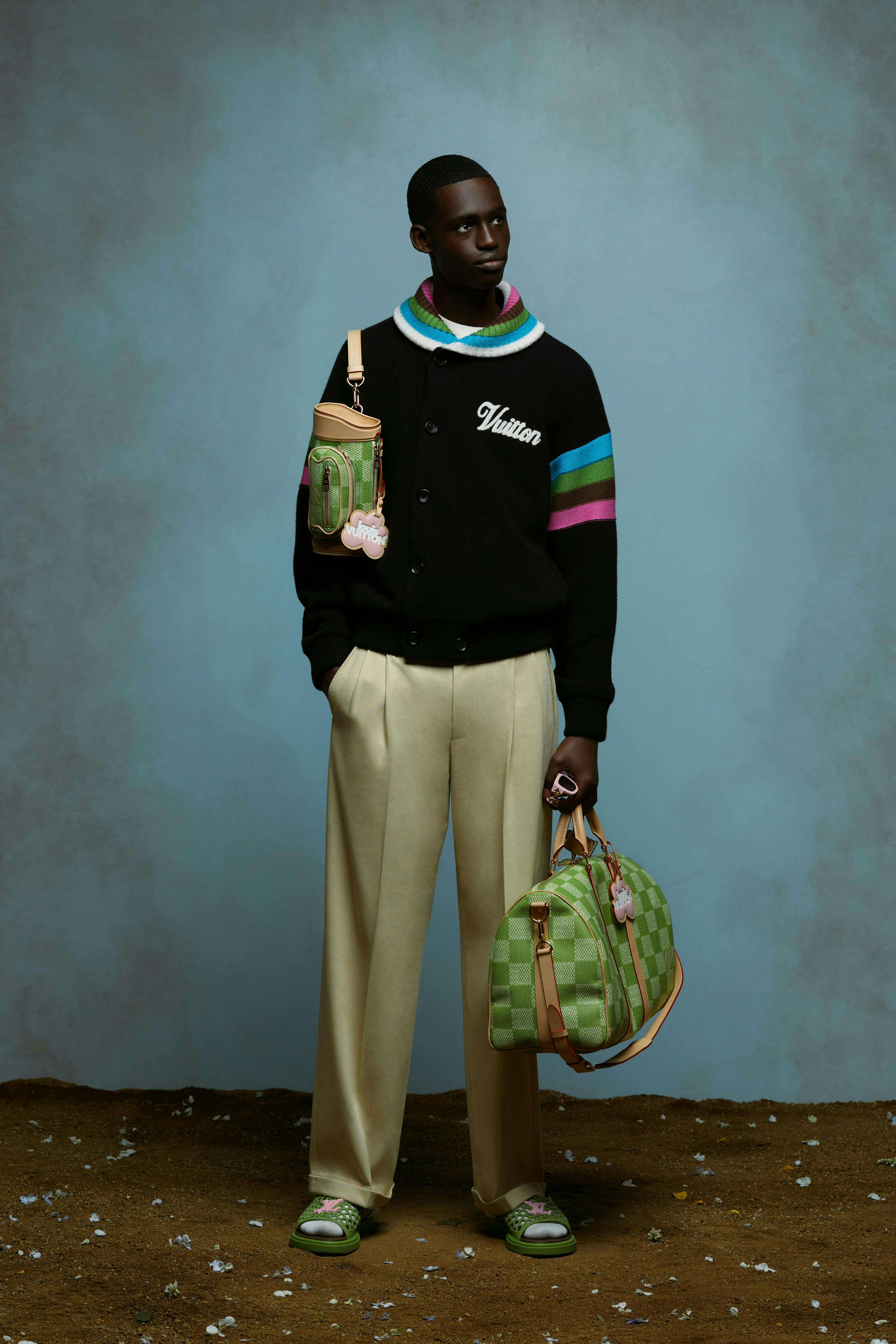 accessories bag handbag purse person standing long sleeve sleeve pants sweater