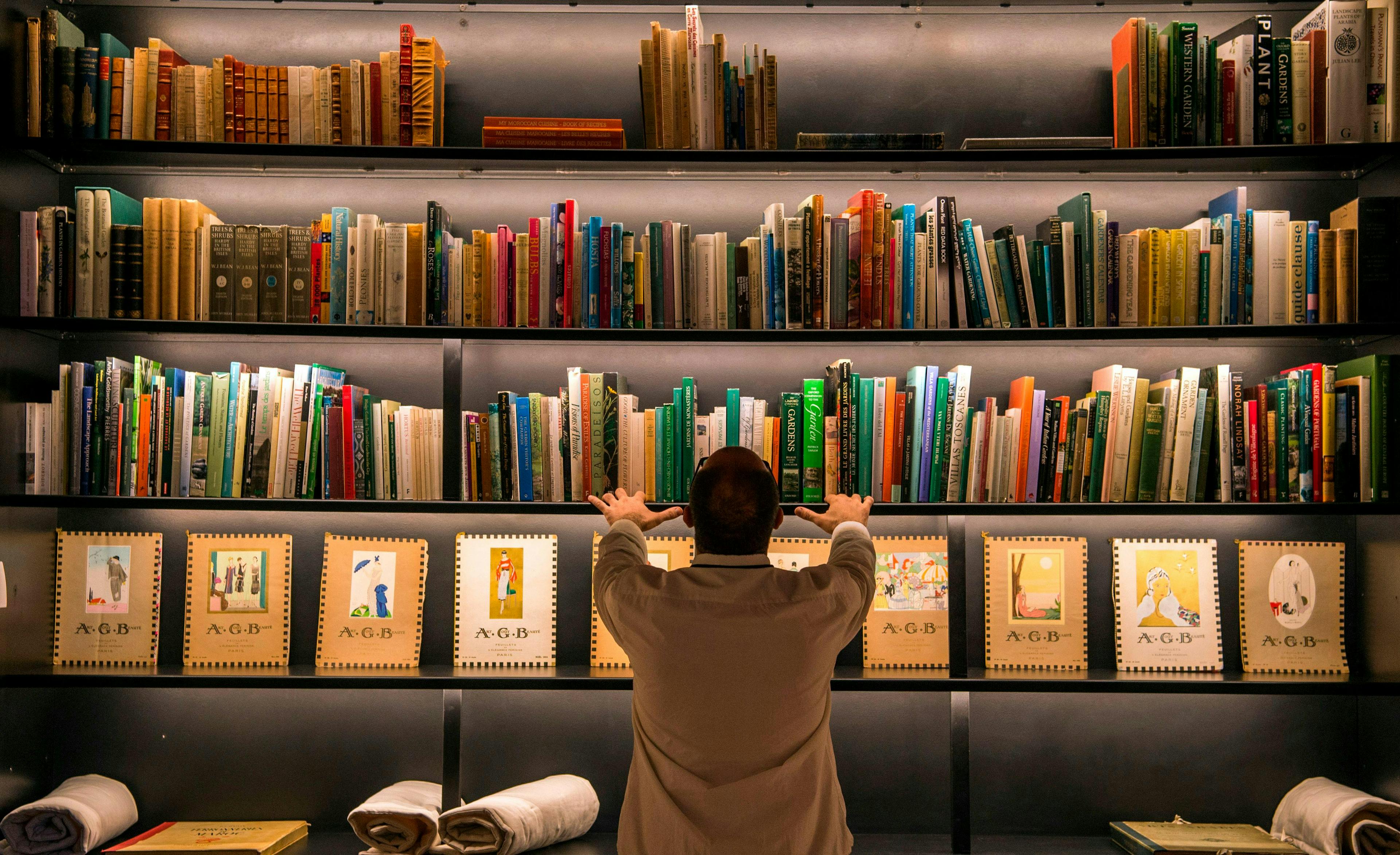 fashion museum horizontal marrakech book library publication furniture adult male man person bookcase shelf